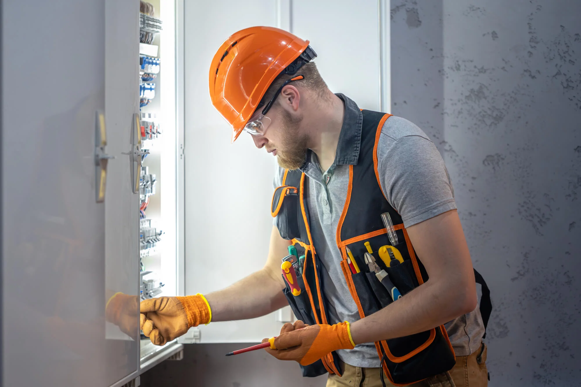 Wilcox technician completing an electrical repair on a loading dock door system