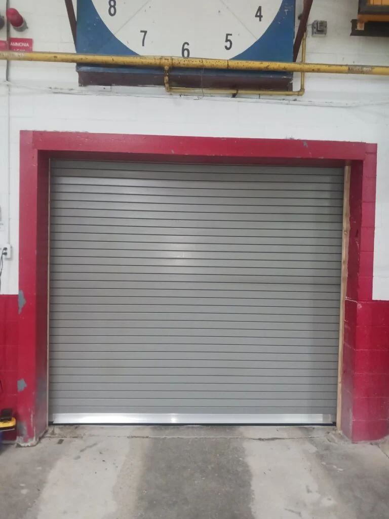 Wilcox crew replacing a rolling steel door at a Stoney Creek arena