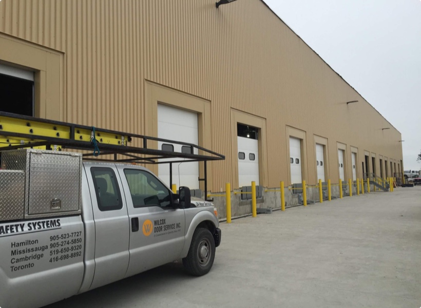 Sectional door install for automotive manufacturer