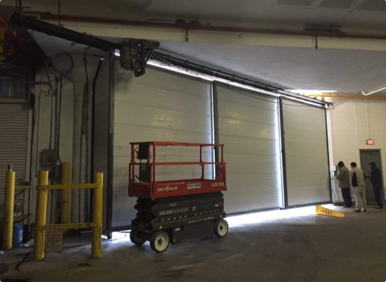 Custom Hangar Doors — Wide-Span Folding Door Replacement