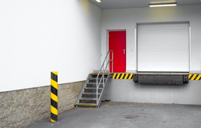 Warehouse door entrance with steel stairs