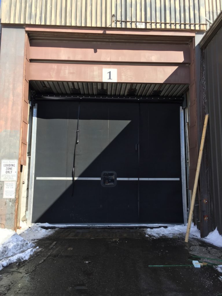 High-Speed Rubber Door Installation — In Front of Existing Rolling Steel Door