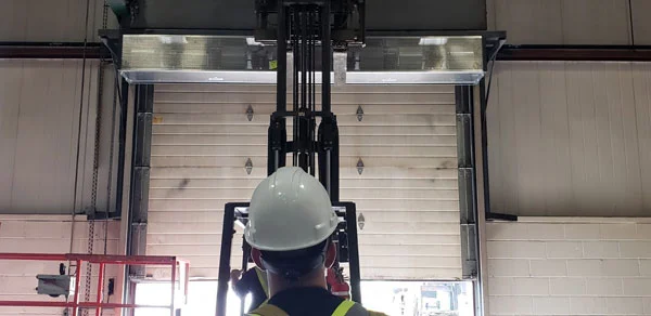 man looking at wellington air curtain installation