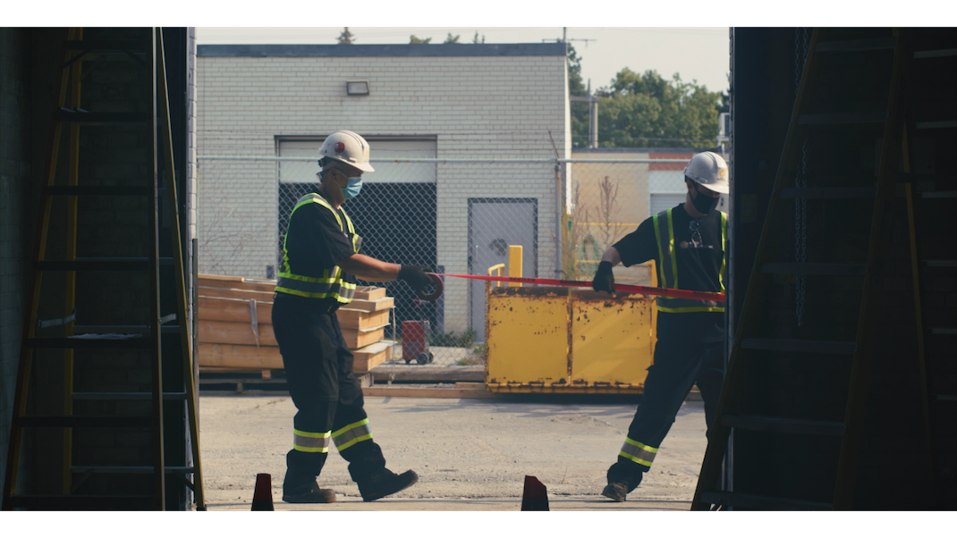 Technicians setting up for fire door droptests - new construction