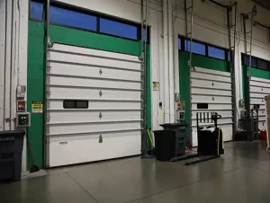 White and green industrial overhead doors