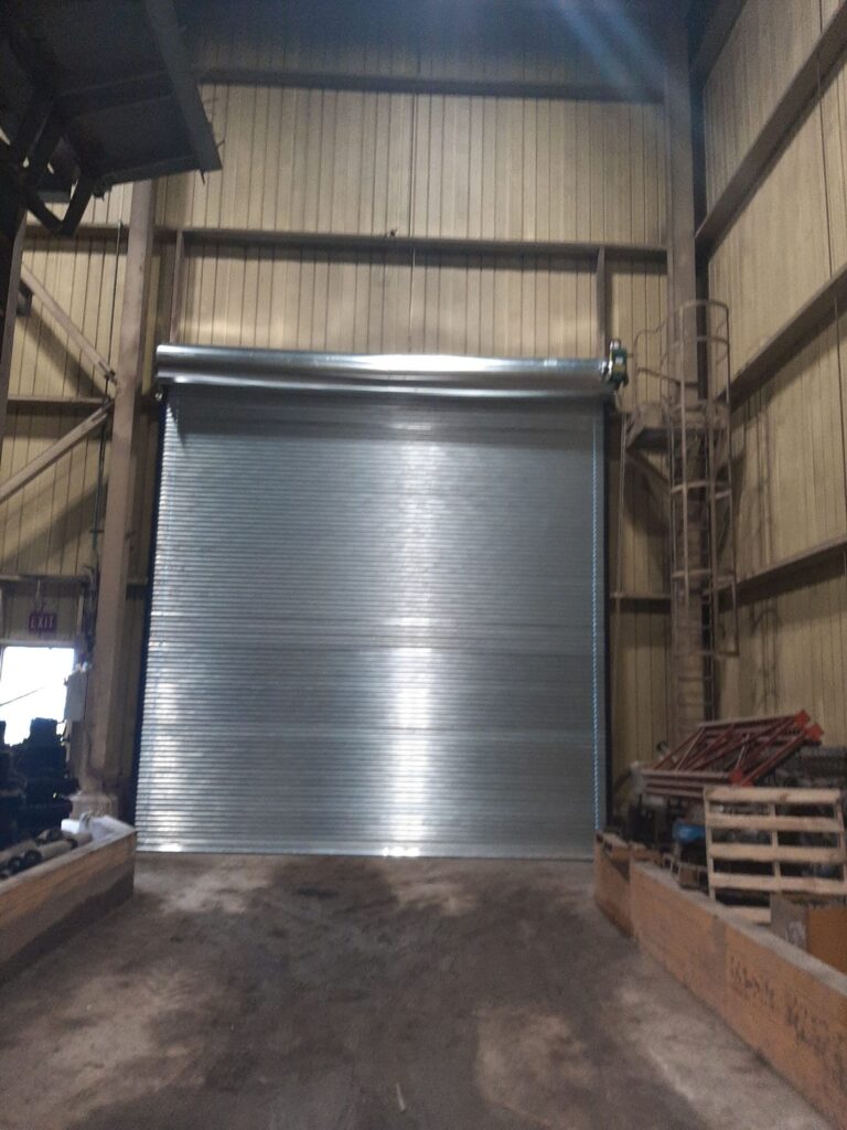 Galvanized Rolling Steel Door with Electric Operator — Heavy Industrial Facility, Brampton